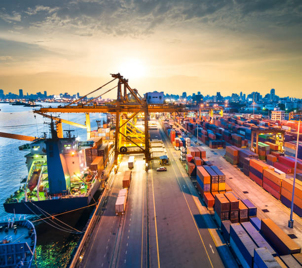 istock Logistics and transportation of Container Cargo ship and Cargo working crane bridge in shipyard 906577838