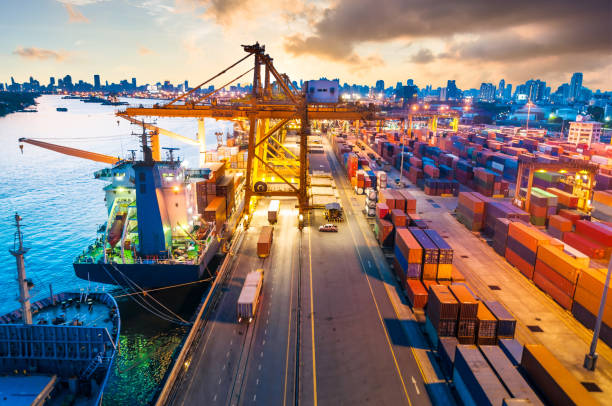 istock Logistics and transportation of Container Cargo ship and Cargo working crane bridge in shipyard 906578282