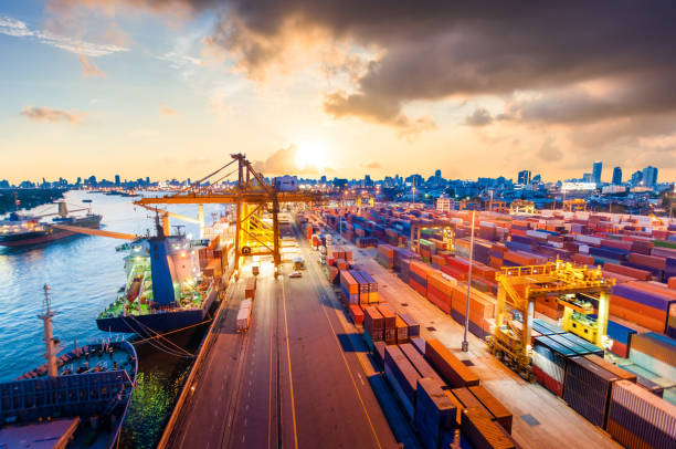 istock Logistics and transportation of Container Cargo ship and Cargo working crane bridge in shipyard 906578284