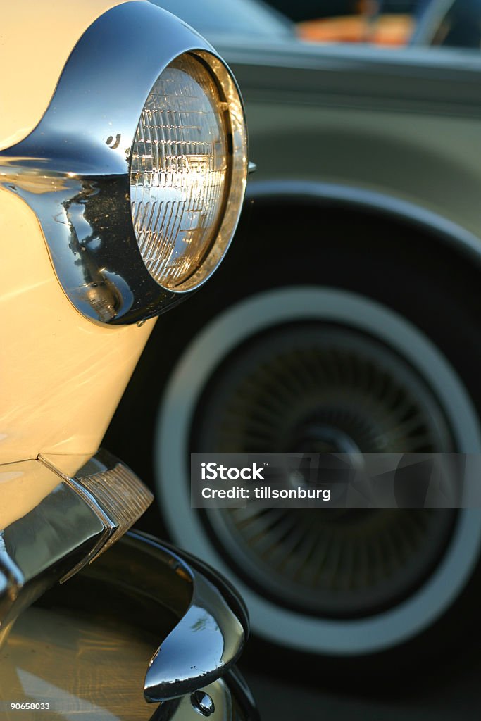 Classic Car Headlight Front lamp of classic car. Shot in sun setting light. 1950-1959 Stock Photo