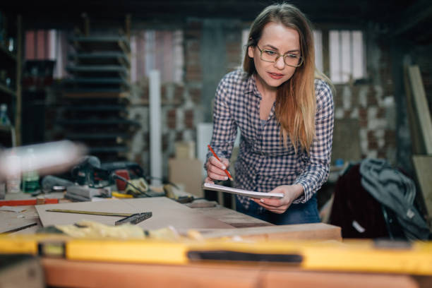 istock Young woman designing in the workshop 906580712