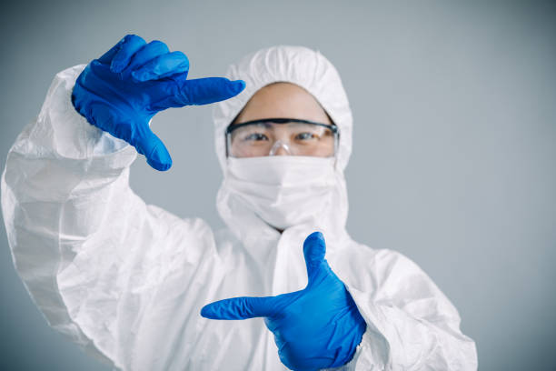 istock Asian female scientist hand frame, studio shot 906583086