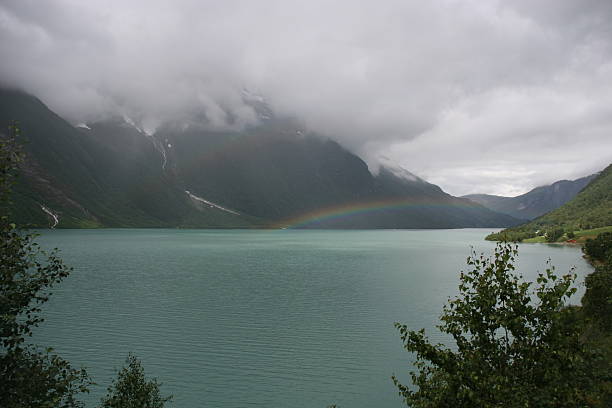 Rainbow in fjord stock photo