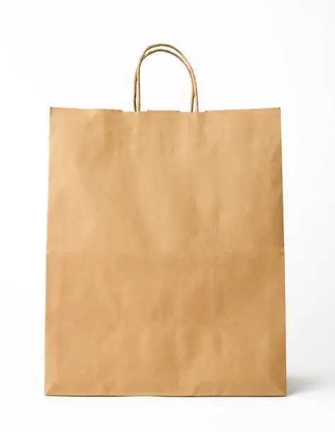 Blank brown shopping bag isolated on white with clipping path.