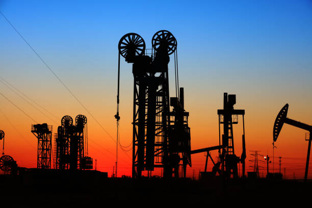 istock The silhouette of tower type pumping unit 906591426