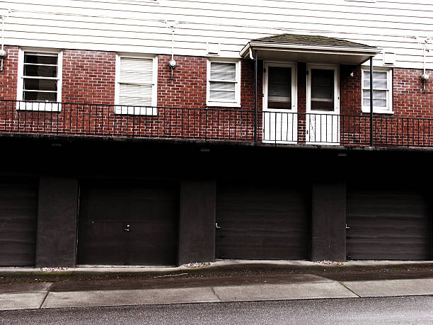 istock Old Red Brick Apartments Above Garages 90659183