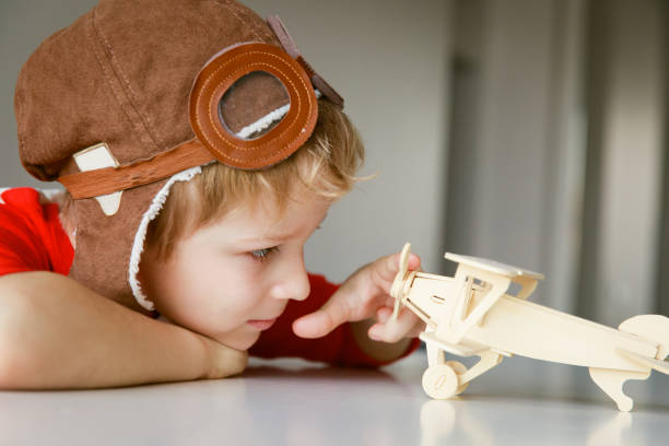 istock little boy making toy plane, play pilot 906596938