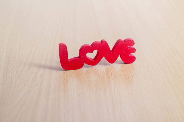 istock word love in  red letters on wood table 906599482