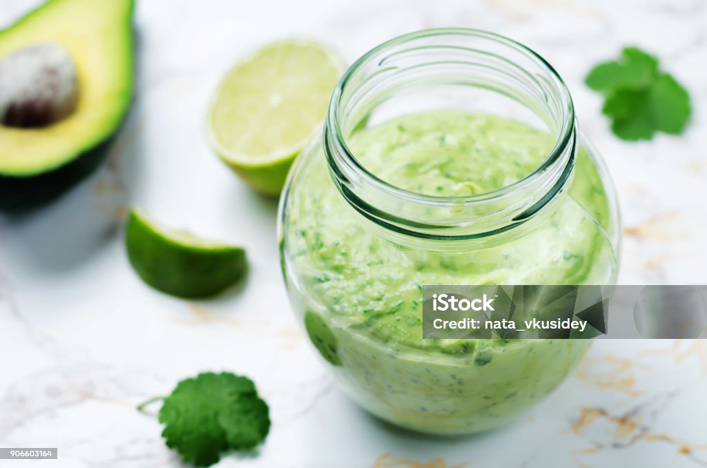 Greek yogurt avocado cilantro lime dressing Greek yogurt avocado cilantro lime dressing. toning. selective focus Avocado Stock Photo