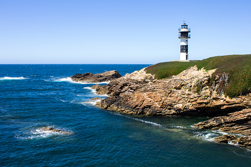 Illa Pancha in Ribadeo, Spain, a beautiful island with two lighthouses guarding the Eo estuary that delimits the border between Galicia and Asturias.