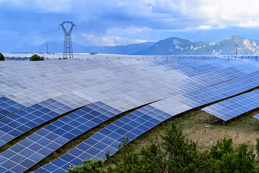 Field of solar power panels on a plateau in Southern Alps, France