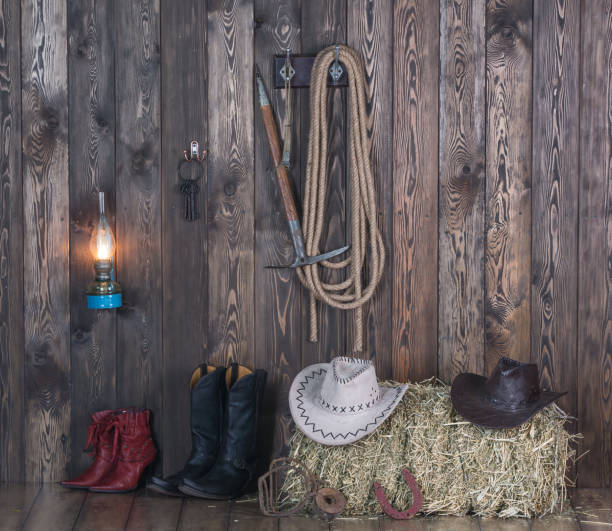 istock old cowboy barn, weapons, clothing, hay 906606218