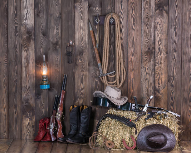 istock old cowboy barn, weapons, clothing, hay 906608594