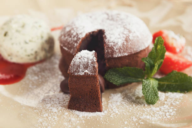 istock Chocolate fondant with vanilla ice cream and strawberry 906612042