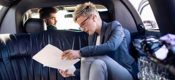 istock Young business woman and her chauffeur 906612224