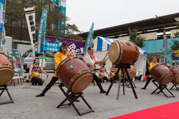 Yokohama, Kanagawa Prefecture, Japan - September 22, 2018: Okinawa eisa dance troupe (鶴見エイサー潮風) giving show on the street of Noge (野毛) at the Jazz de Bon Odori 2018 an annual Jazz music event in Yokohama on Saturday. \nEisa is an Okinawan folk dance that marks the end of the Bon festival (お盆, 盆祭り).