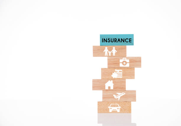 istock wooden blocks with insurance concept isolated on white background. 906618976