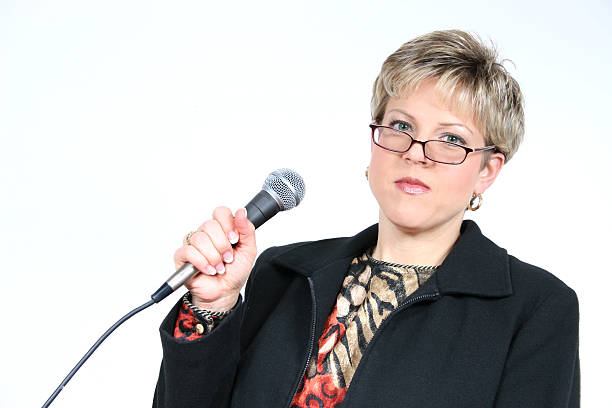 istock Business Woman in Black with Microphone 90661914