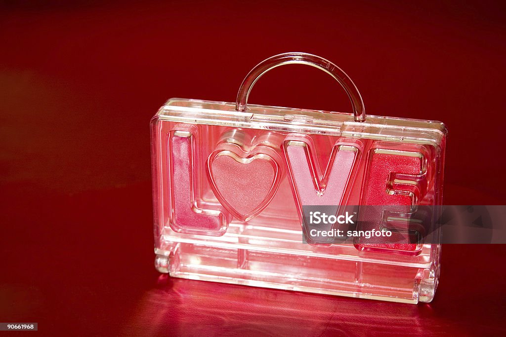 Love Bag lip cosmetic set in a bag on red background Adult Stock Photo