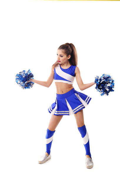 istock Young cheerleader in blue and white suit with pompoms on white background. Isolated on white background. 906626400