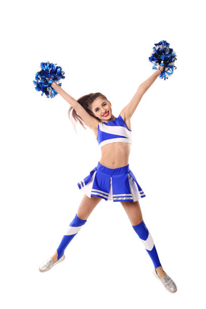 istock Young cheerleader in blue and white suit with pompoms on white background. Isolated on white background. 906626428