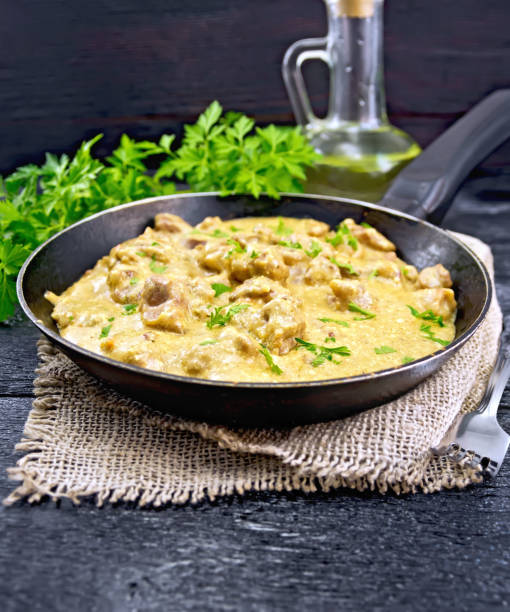 istock Meat stewed with cream on black board 906627002
