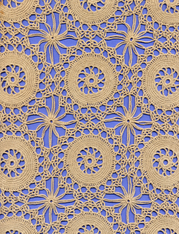 Crochet lace ground made of circular motifs.