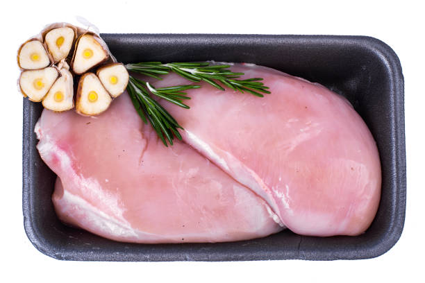 istock Raw chicken fillet with garlic and spices 906627044