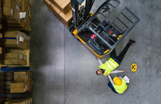 istock An injured worker after an accident in a warehouse. 906632226