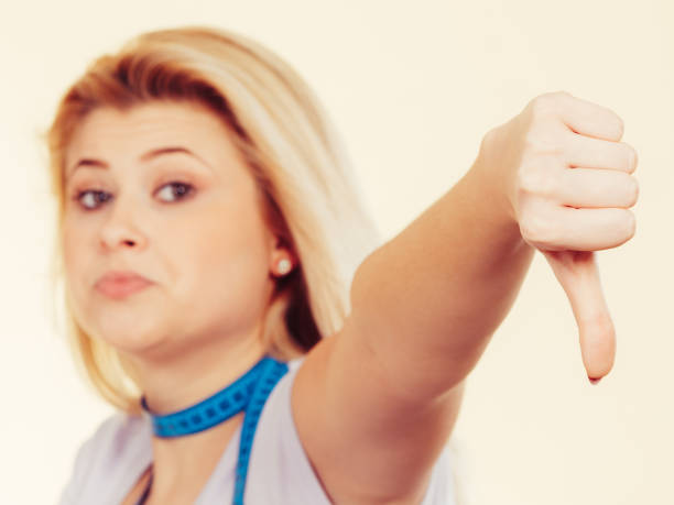 istock Woman having measuring tape around neck 906632238