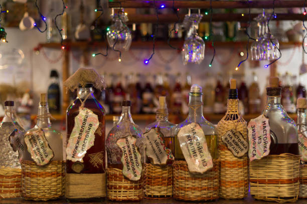 Bottles with alcoholic beverages are at the bar.