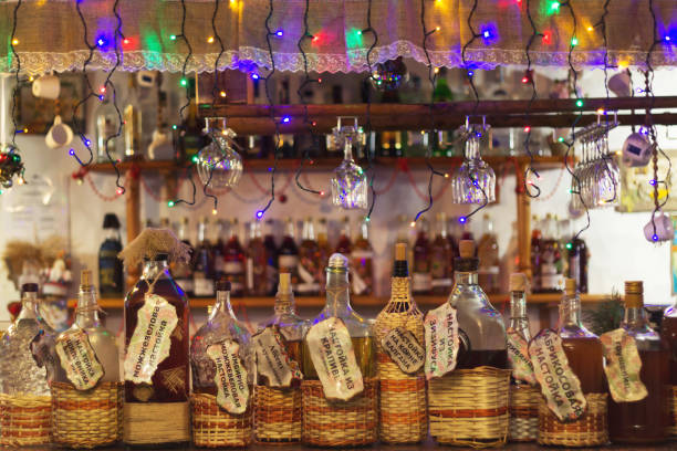 Bottles with alcoholic beverages are at the bar.
