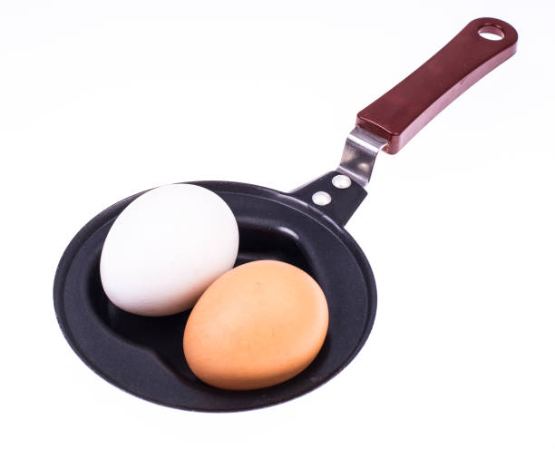 Whole egg in the frying pan Whole egg in the frying pan. Studio Photo thick chicks stock pictures, royalty-free photos & images