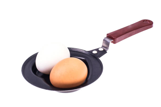Whole egg in the frying pan Whole egg in the frying pan. Studio Photo thick chicks stock pictures, royalty-free photos & images