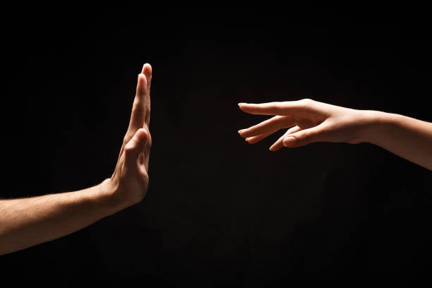 istock Male and female hands on black isolated studio background 906637952