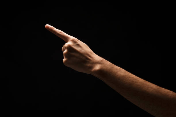 istock Hand gestures - man pointing, isolated at black 906638130
