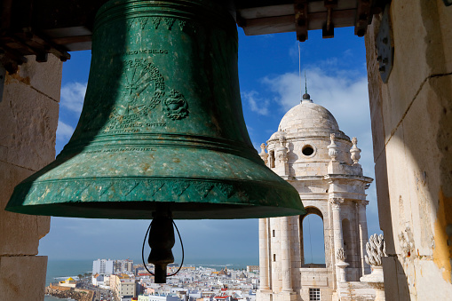 Bell and one of the two towers of the New Cathedral Cadiz, Spain