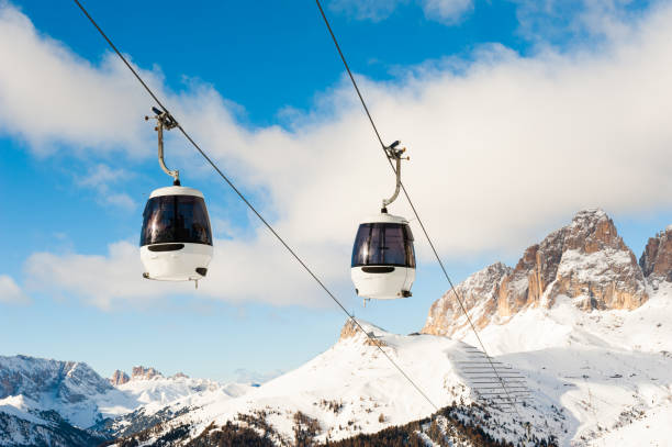 Ski lift in Val di Fassa ski resort in winter Dolomites, Italy