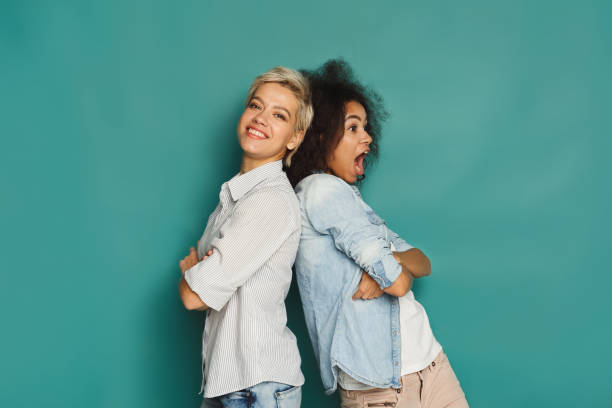 istock Emotional friends having fun at blue background 906644504