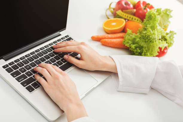 istock Female nutritionist working on laptop 906647818