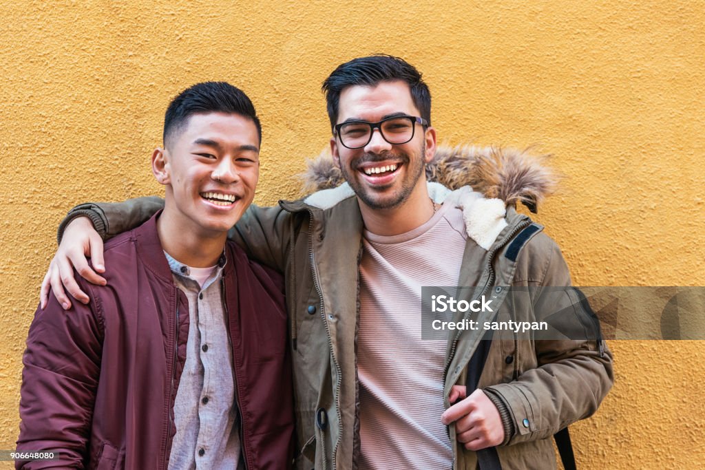 Portrait of group of friends looking the camera in the street. Portrait of group of friends looking the camera in the street. Friendship concept. Friendship Stock Photo