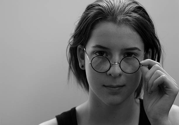 istock studious teen female with round glasses 90664851