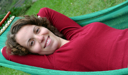 A woman relaxes in a hammock