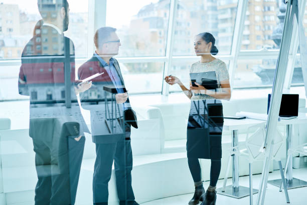 istock Diversity group of professional marketing expert having discussion during conference sharing ideas for startup.Afro american female manager presenting her project explaining strategy to colleagues 906655072