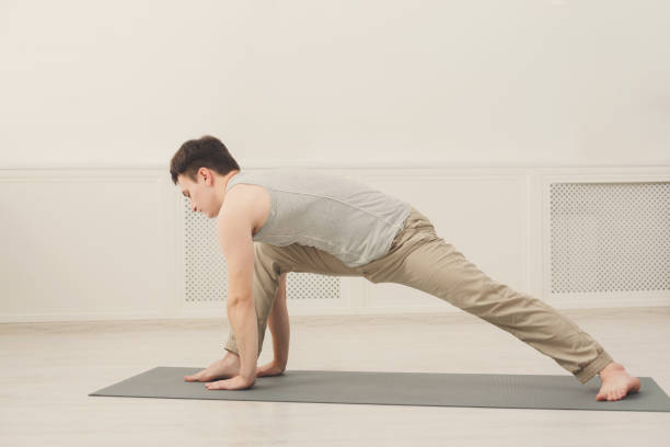 istock Fitness man plank training indoors 906655306