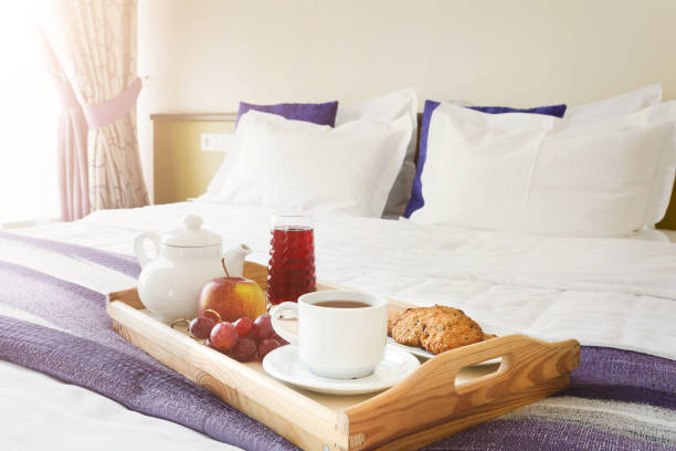 istock Breakfast served in bed on wooden tray 906660982