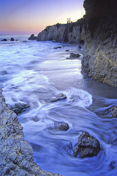 rocky beach sunset  ebb and flow stock pictures, royalty-free photos & images