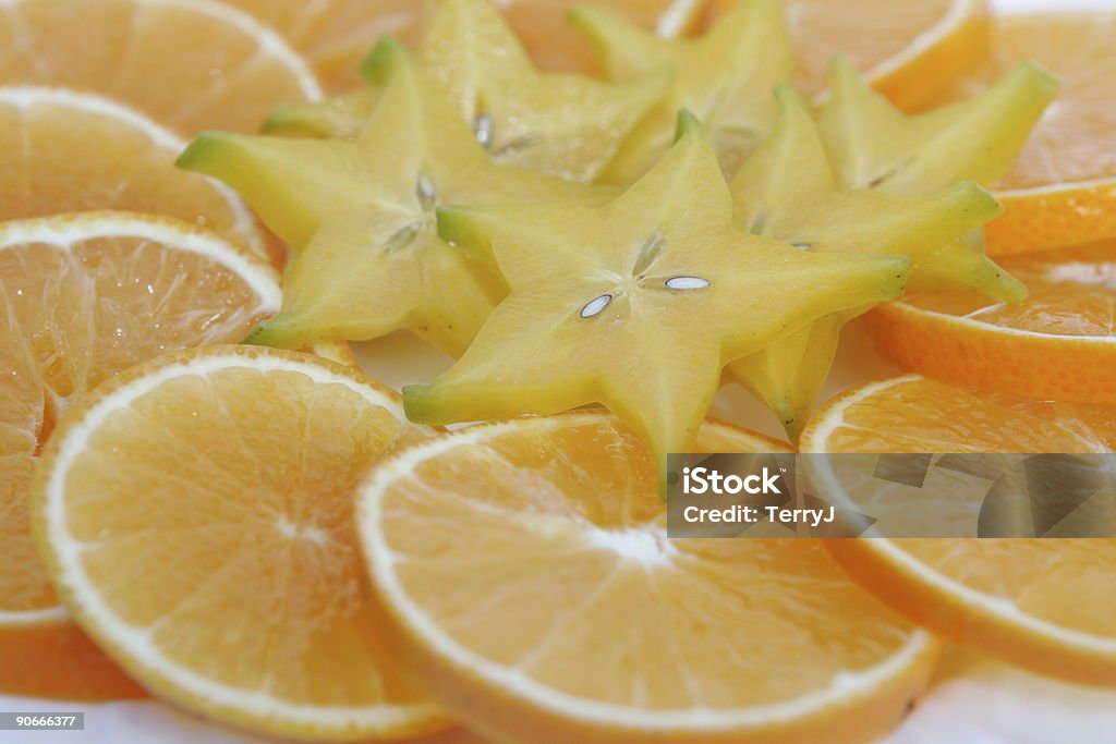 Carambola & arance - Foto stock royalty-free di A forma di stella