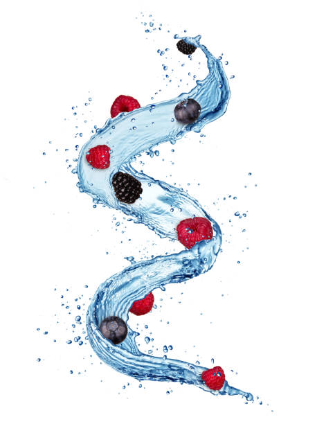istock Pieces of berry fruit in water splashes isolated on white background 906689772