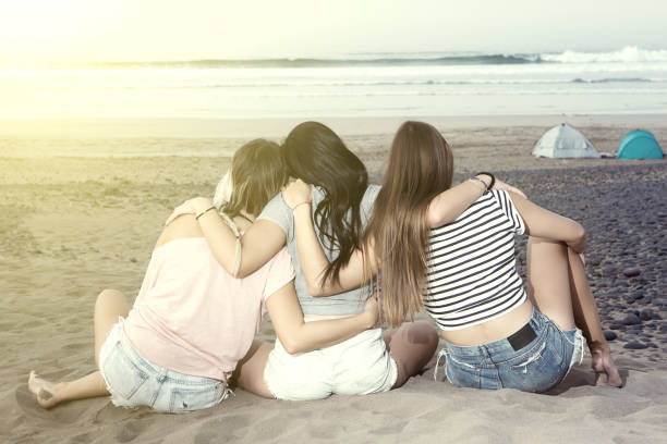 istock Embracing women on beach 906691846